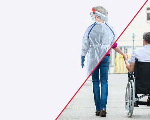 A man in a wheelchair and a woman in a hospital gown, possibly in a medical facility.