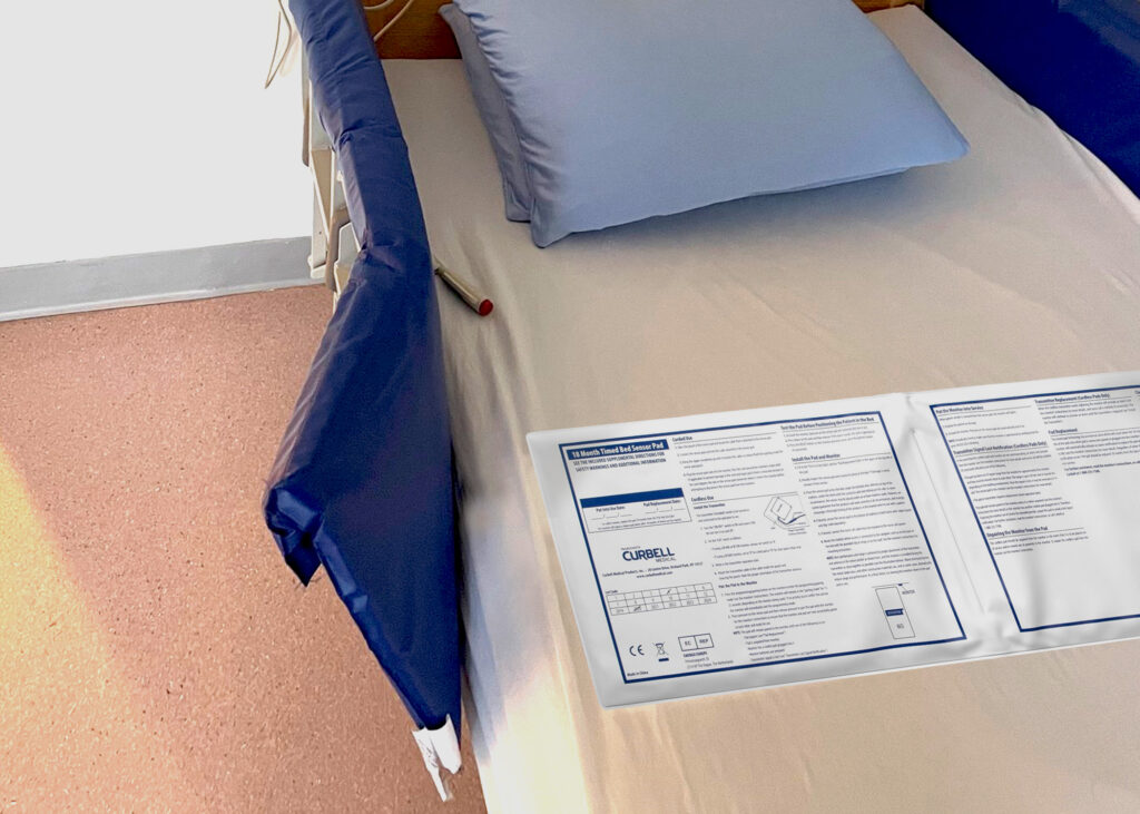 A hospital bed with a bed and chair sensor pad.